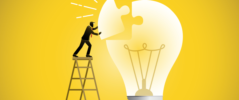 A person in a suit stands on a ladder, placing a missing puzzle piece into a large glowing lightbulb against a bright yellow background. "Zamit Shots" symbolising creativity and problem-solving.