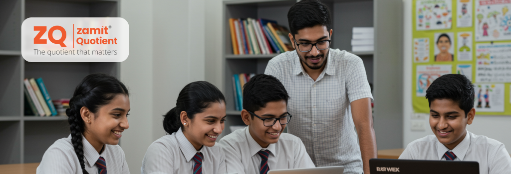 Teacher guiding students on laptops in a classroom, showcasing the Zamit Quotient in action and its positive impact on Educational Outcomes.
