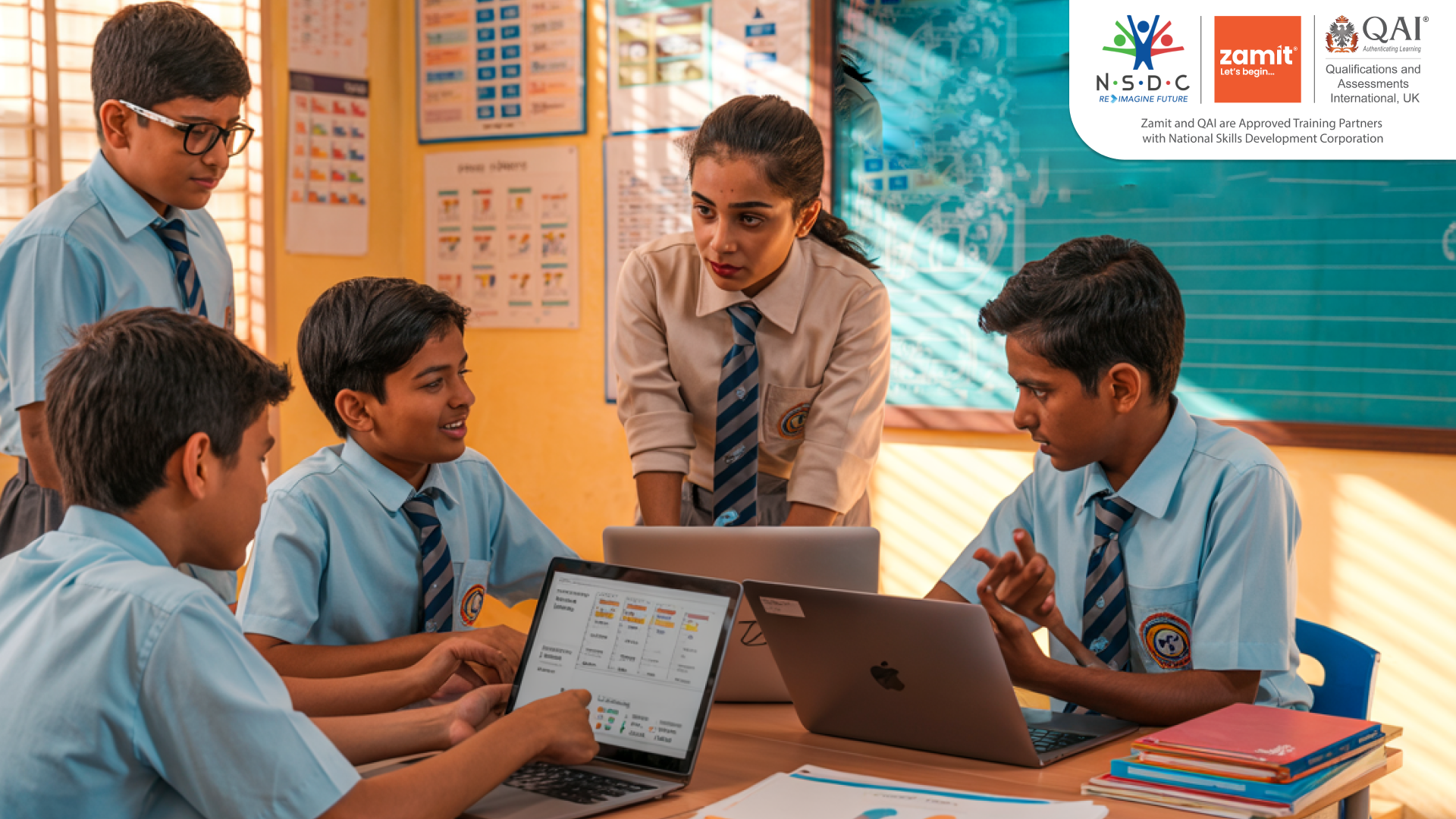 Students and teacher using laptops during a classroom activity, demonstrating digital learning and benchmarking in school with Zamit’s assessment tools.